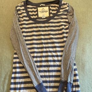 Striped blue and gray long sleeve shirt.